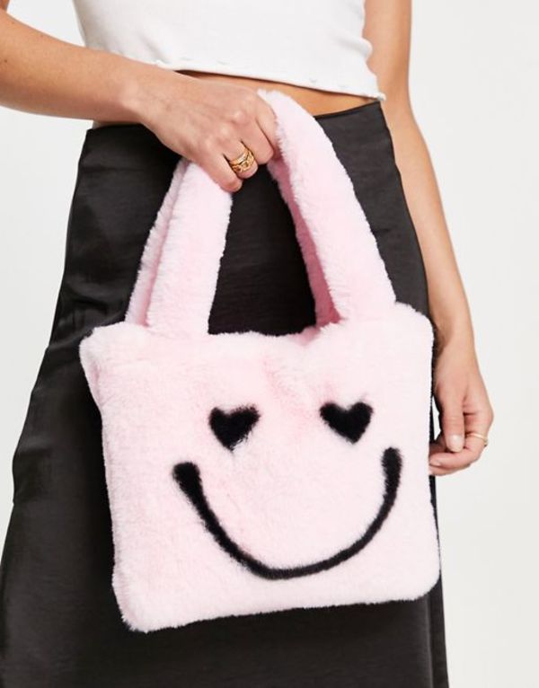 エイソス レディース トートバッグ バッグ ASOS DESIGN mini tote bag in faux fur happy face print in pink Pink