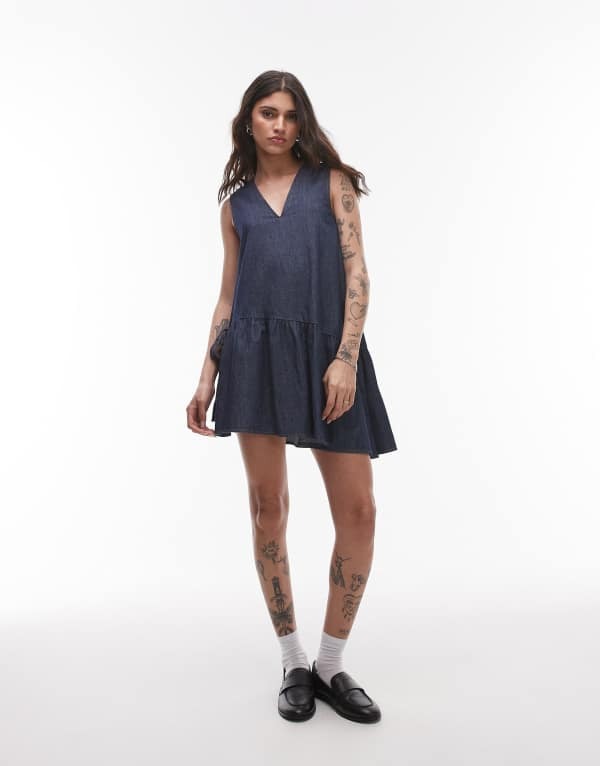 トップショップ レディース トップス ワンピース ミニワンピース ミニ デニム Topshop denim mini dress with peplum hem and bow detail in raw look indigo INDIGO インディゴ|ReVida 店