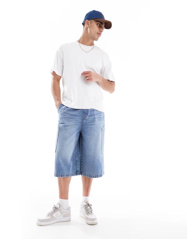 エイソス メンズ ボトムス ハーフパンツ・ショーツ デニム ASOS DESIGN longer length denim jorts in mid wash blue with cargo pocket details Mid wash blue ブルー