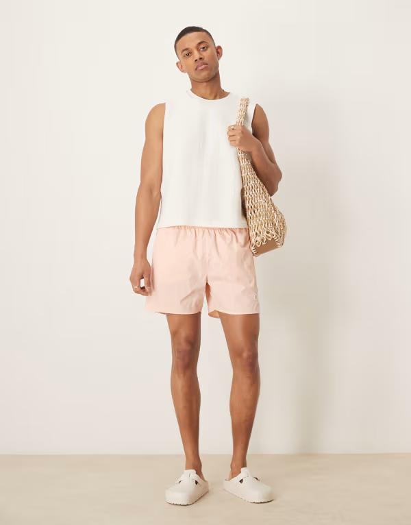 カルバンクライン メンズ 水着 ハーフパンツ・ショーツ ショートパンツ ロゴ Calvin Klein drawstring logo swim shorts in peach Light Cantaloupe ピンク 14,950円