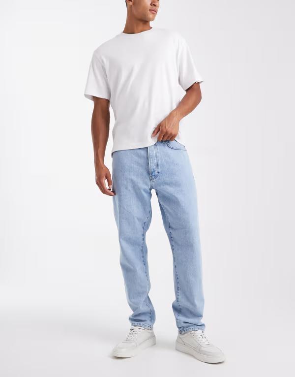オンリーアンドサンズ メンズ ボトムス デニムパンツ テーパードフィット ジーンズ ONLY & SONS Tye loose tapered fit jeans in light wash Light Blue Denim デニム