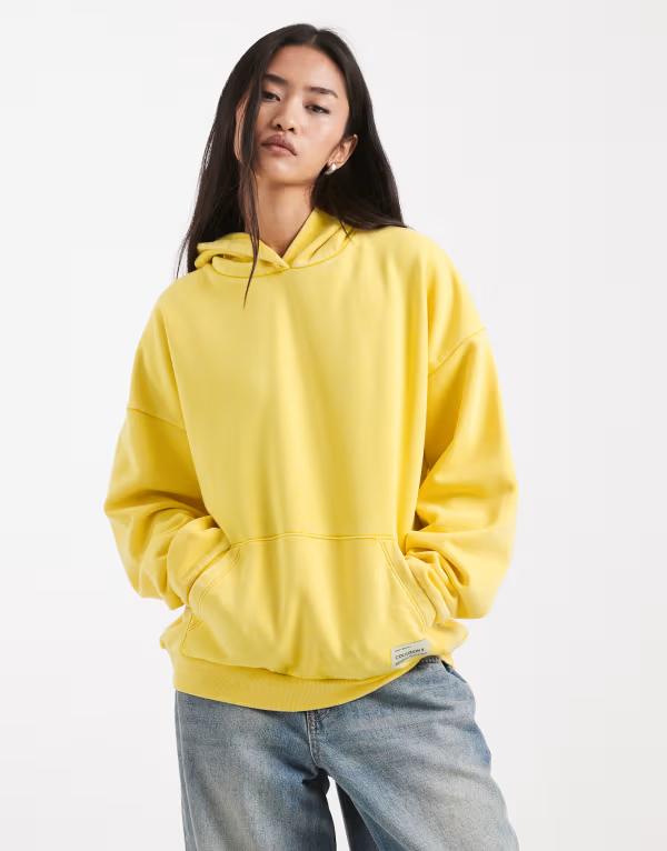コルージョン レディース アウター パーカー・スウェット COLLUSION oversized washed hoodie インチ yellow 黄色