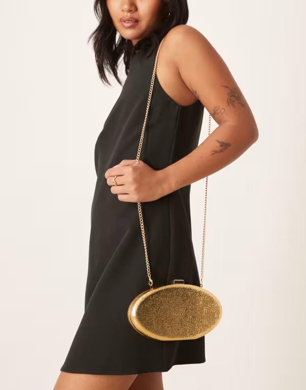 トゥルーデカデンス レディース バッグ True Decadence oval hard clutch bag in textured GOLD ゴールド