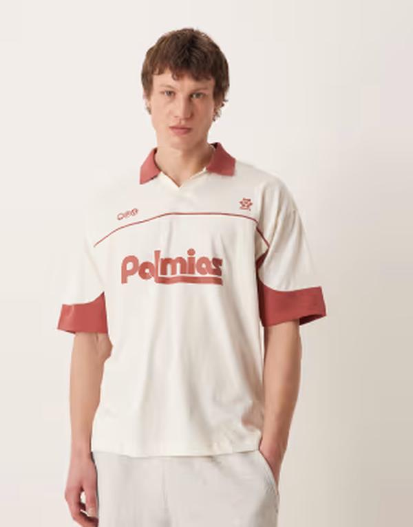 エイソス メンズ トップス ポロシャツ グラフィック ASOS DESIGN oversized polo shirt with soccer graphic and Coconut milk オフホワイト