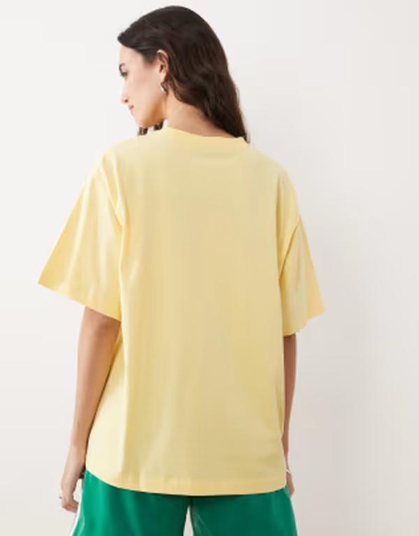 エイソス レディース トップス Tシャツ グラフィック ASOS DESIGN short sleeve oversized t-shirt with running club graphic in buttermilk