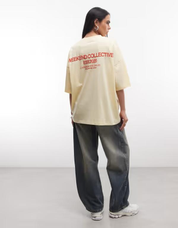 エイソス レディース トップス Tシャツ グラフィック ASOS Weekend Collective Weekend Collective Icon oversized T-shirt with bold font back graphic in yellow イエロー｜ReVida 店