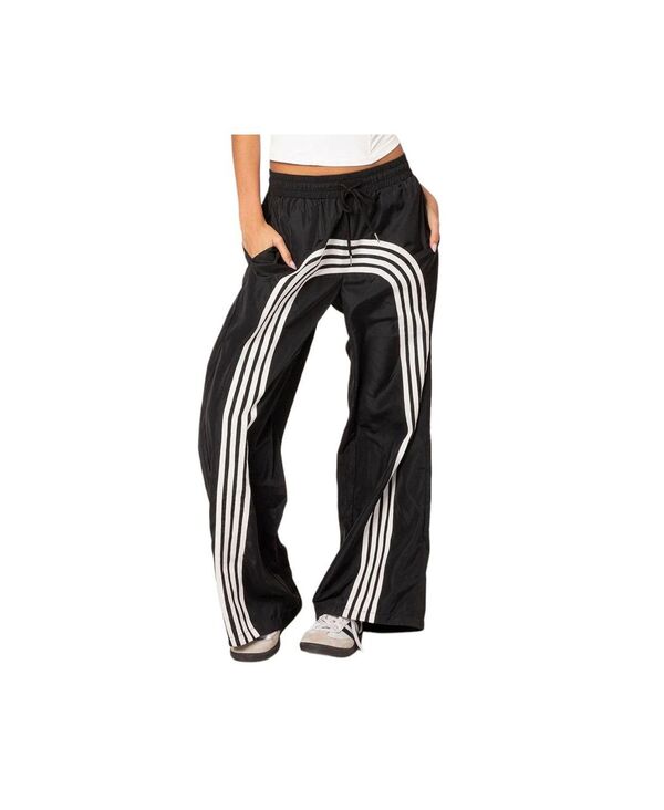 アディクテッド レディース ボトムス カジュアルパンツ トラックパンツ ナイロン パンツ Edikted Women's Wilda striped nylon track pants Black-and-white ホワイト