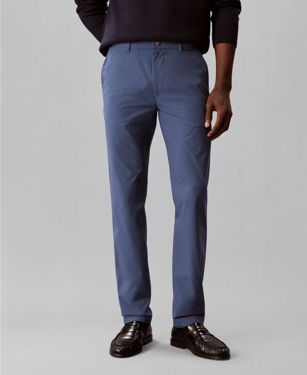 【送料無料】 カルバンクライン メンズ カジュアルパンツ ボトムス Men's Slim-Fit Tech Stretch Pants Crayon Blue