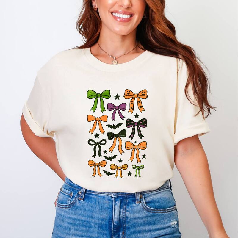 Simply Sage Market レディース トップス ティーシャツ グラフィック Simply Sage Market Coquette Colorful Halloween Bows - Women\u0027s Garment Dyed Graphic T-Shirt Ivory 象牙色 トップス-Tシャツ・カットソー-レディースファッション