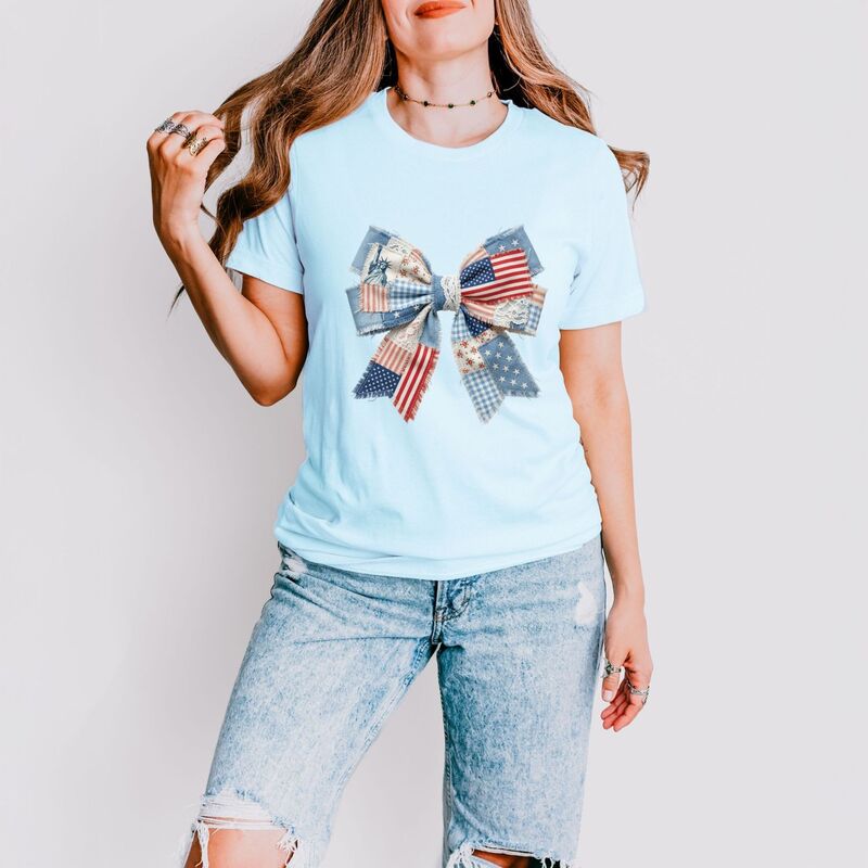 Simply Sage Market レディース トップス Tシャツ パッチワーク デニム グラフィック Simply Sage Market Patriotic Bow Faux Denim Patchwork - Women'short Sleeve Graphic T-Shirt Ice Blue ブルー