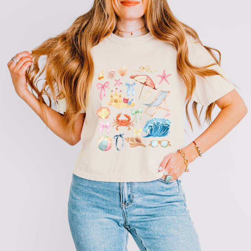 Simply Sage Market レディース トップス Tシャツ グラフィック Simply Sage Market Beach Collage Watercolor - Women's Boxy Crop Top Graphic T-Shirt Ivory アイボリー|ReVida 店