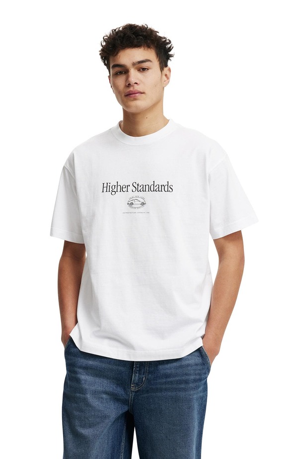 コットンオン メンズ トップス Tシャツ グラフィック Cotton Men's Box Fit Graphic T-Shirt White Higher Standards ホワイト