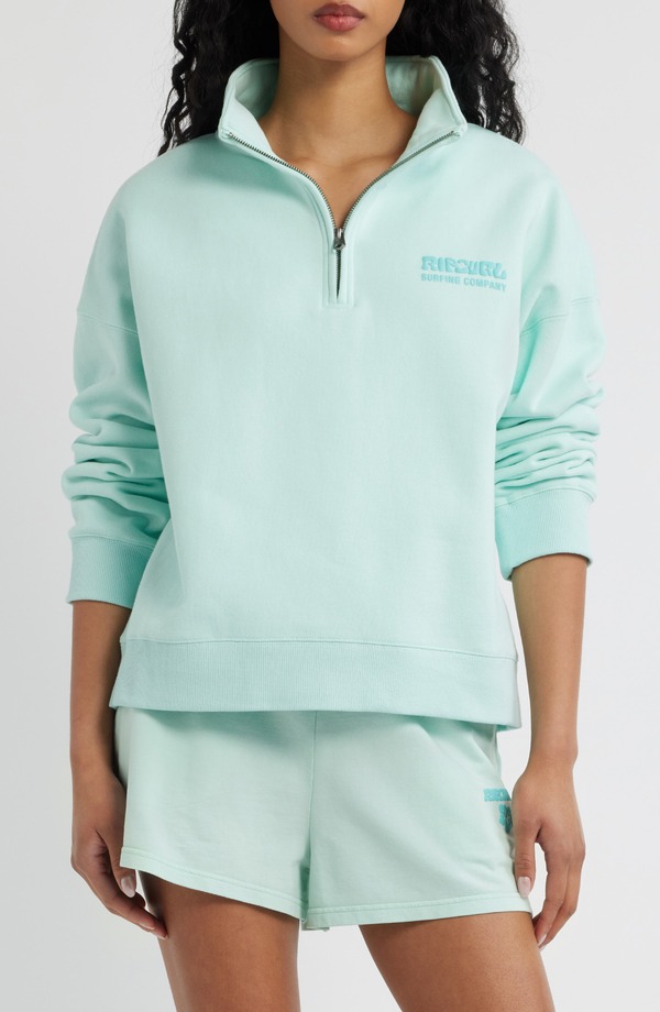リップカール レディース アウター パーカー・スウェット ハーフジップ シャツ ロゴ Rip Curl Surf Puff Logo Quarter Zip Sweatshirt Light Blue ブルー|ReVida 店