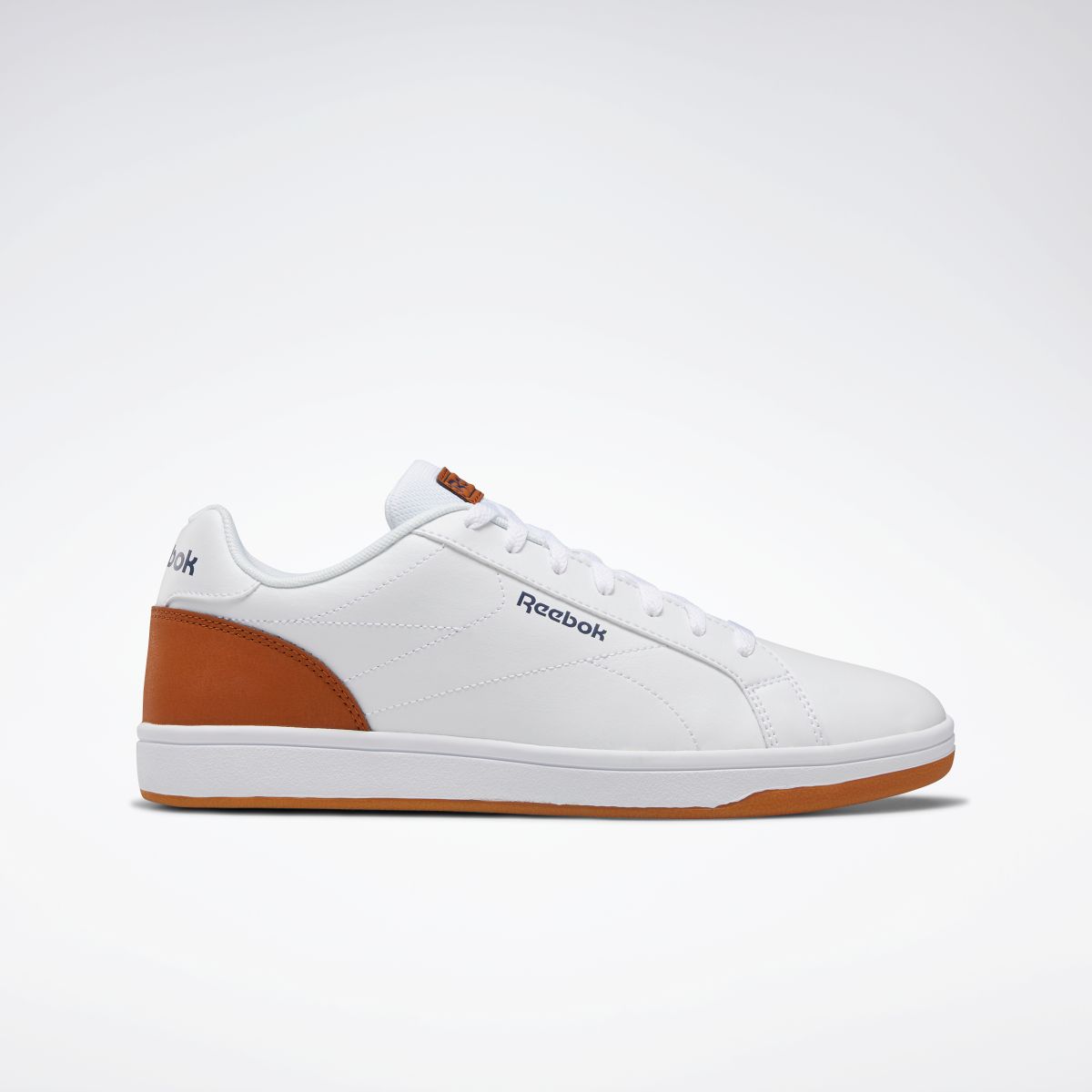 white and brown reebok
