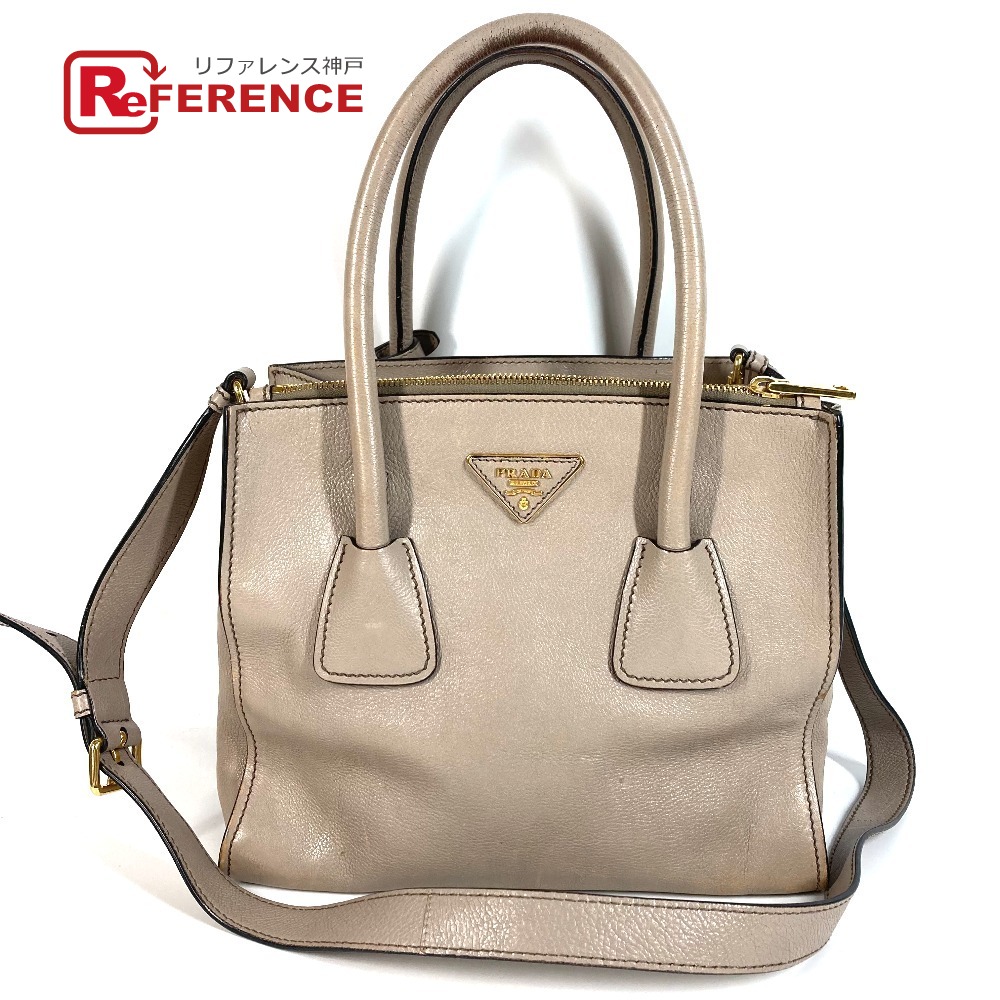 PRADA プラダ 2WAYバッグ トライアングルロゴ 三角ロゴ プレート ハンドバッグ カバン ショルダーバッグ 斜め掛け トートバッグ レザー ユニセックス ベージュ系 【中古】｜ブランドショップ　リファレンス 20,592円