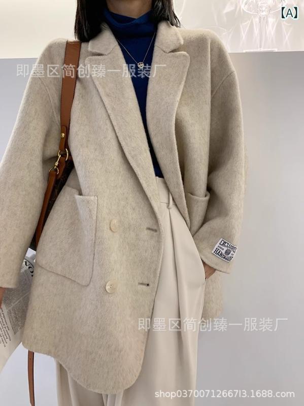 パステル色の モチと した ダブル 名取り草の 両面 毛は、 亭主もちの 韓国 版の大きな 隠しの 羊の キャメルケースの ヘップバーン 風の ごく小さい 背の 小っちゃい 厚地の外套です。