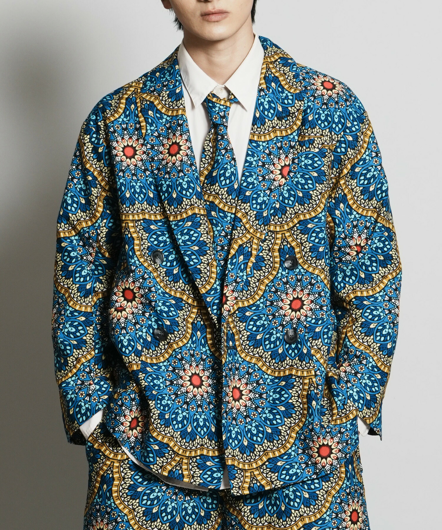 AFRICA PEAKED LAPEL DOUBLE JACKET アフリカダブルジャケット モヤンエクリ moyan ecri ユニセックス アウター 総柄 アフリカ ナイジェリア 寄付 花 秋冬