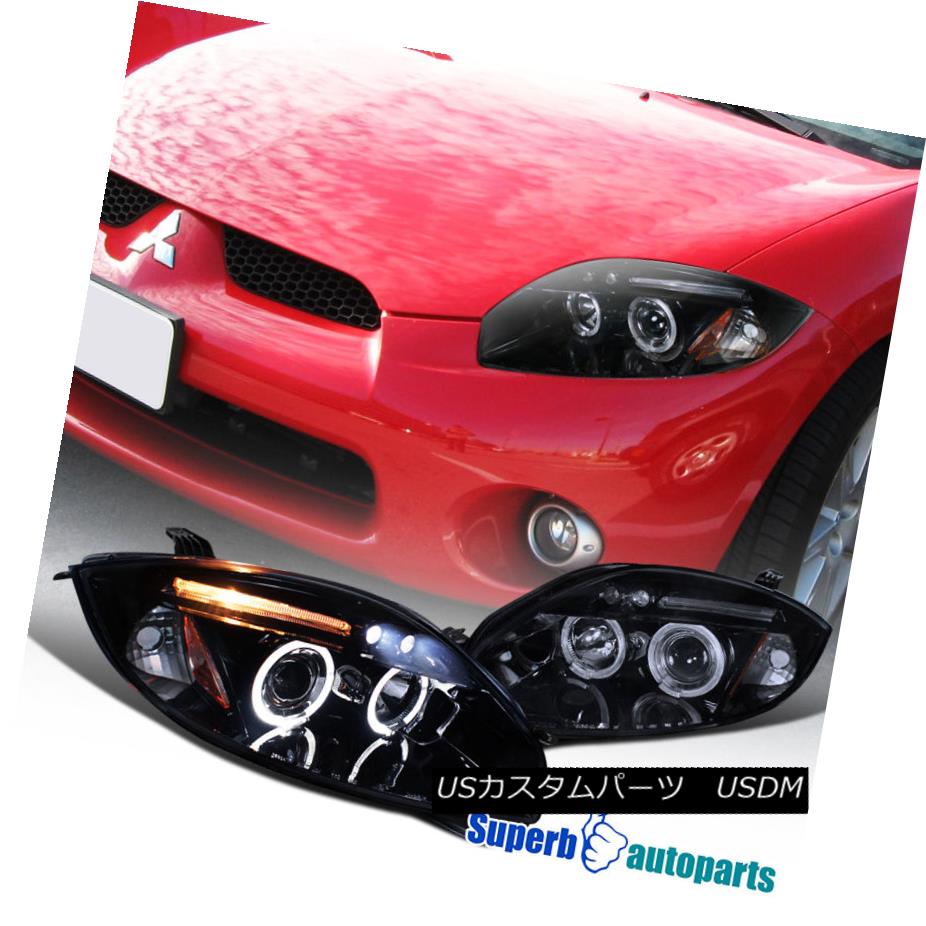 ヘッドライト 2006-2011 Eclipse LED Eyelid Dual Halo Projector Headlights Glossy Black / Smoke 2006年?2011年Eclipse LEDアイライトデュアルヘイロープロジェクターヘッドライト光沢ブラック/スモーク 【並行輸入品】
