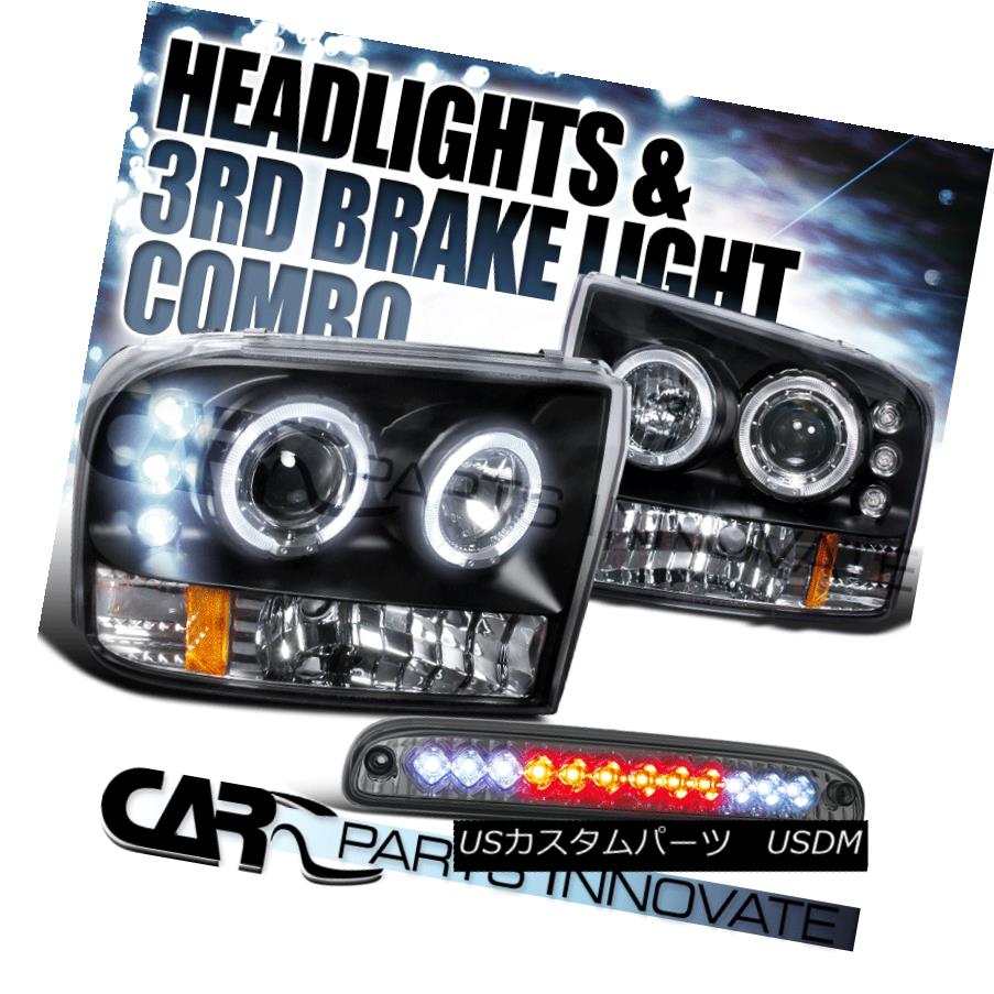 ヘッドライト 99-04 Ford Super Duty Black Halo Projector Headlights+Smoke LED 3rd Brake Lamp 99-04フォードスーパーデューティーブラックハロープロジェクターヘッドライト+スモーキー ke LED第3ブレーキランプ 【並行輸入品】