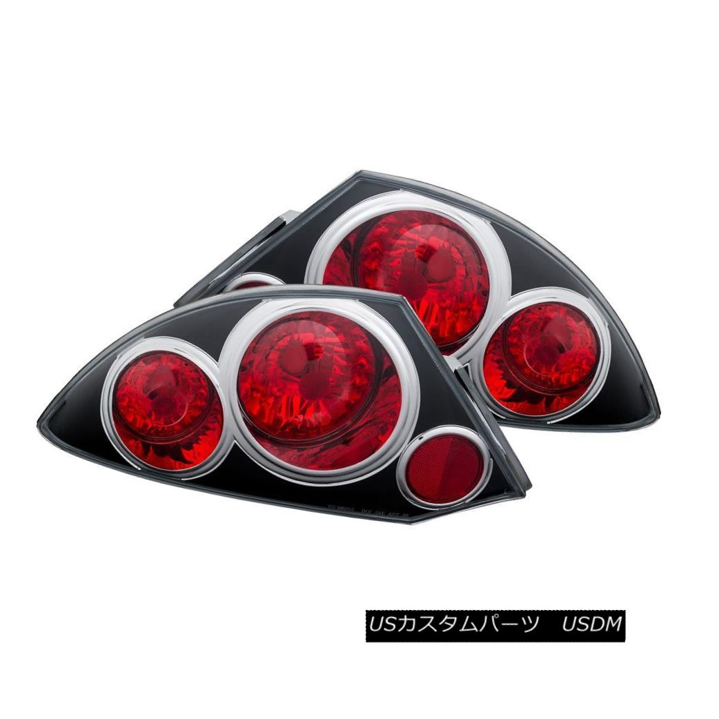 テールライト ANZO 221081 Black Halogen Tail Lights for 00-02 Mitsubishi Eclipse (Set of 2) ANZO 221081 00-02 Mitsubishi Eclipse（2セット）用ブラックハロゲンテールライト 【並行輸入品】