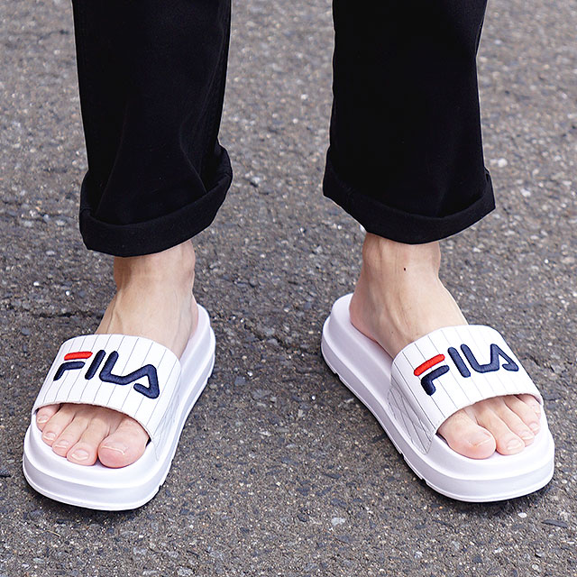 fila sandals on feet