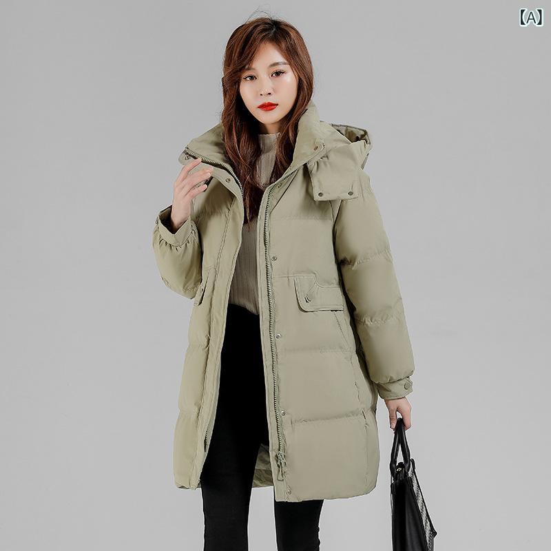 専門 店の ブランドの ダウン ジャケットの 女性は 厚い 中の 長 さの 冬の 帽子を 合わせて 大きい サイズの 冬の 服の アヒルの 毛の 保温の コートを 着ます。