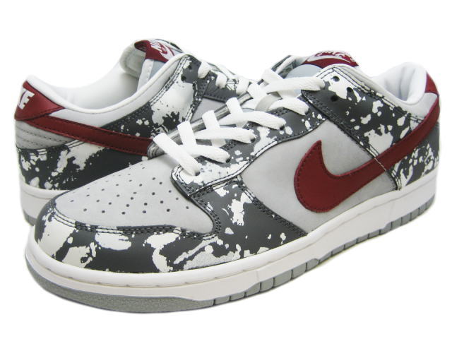 well worn white and sliver nike dunks low