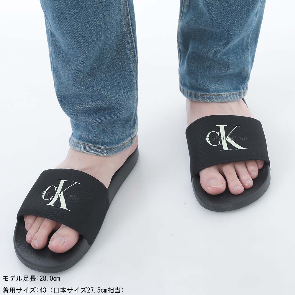 カルバンクライン   Jeans Monogram WN サンダル Calvin Klein（カルバン・クライン）の「モノグラム サンダル