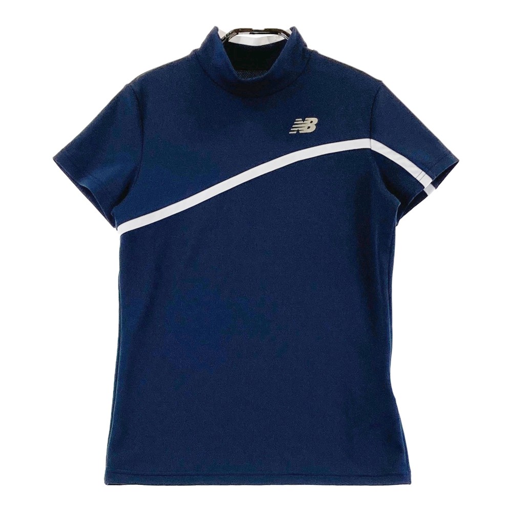 サイズ：1 NEW BALANCE GOLF ニューバランス 2023年モデル ハイネック 半袖Tシャツ チュニック丈 総柄 ベージュ系 [240101438794] ゴルフウェア レディース ストスト NEW BALANCE GOLF ニューバランス 2023年モデル ハイネック 半袖
