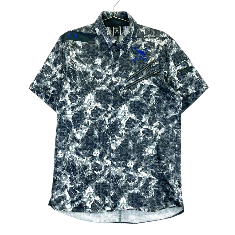 サイズ：L OAKLEY オークリー 434390JP 半袖ポロシャツ ボタンダウン 総柄 グリーン系 [240101494240] ゴルフウェア メンズ ストスト OAKLEY オークリー 434390JP 半袖ポロシャツ ボタンダウン 総柄