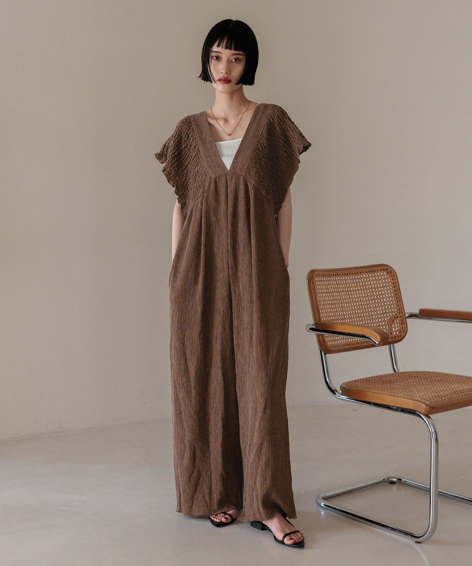 emmi atelier　ポンチョ風ケーブルニット emmi ポンチョ風ケーブルニット - トップスオンライン ストア