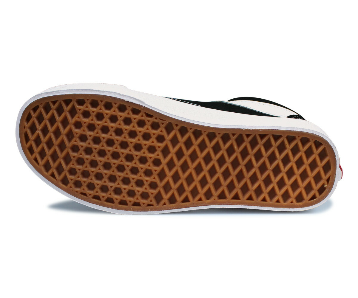 black vans tan bottom