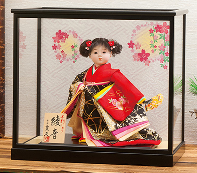 japanese doll in glass case