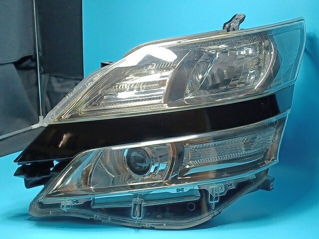 【中古】コーティング済 ヴェルファイア ANH25W 左ヘッドランプ・ヘッドライト 2.4V イチコ 58-23 81150-58130 202