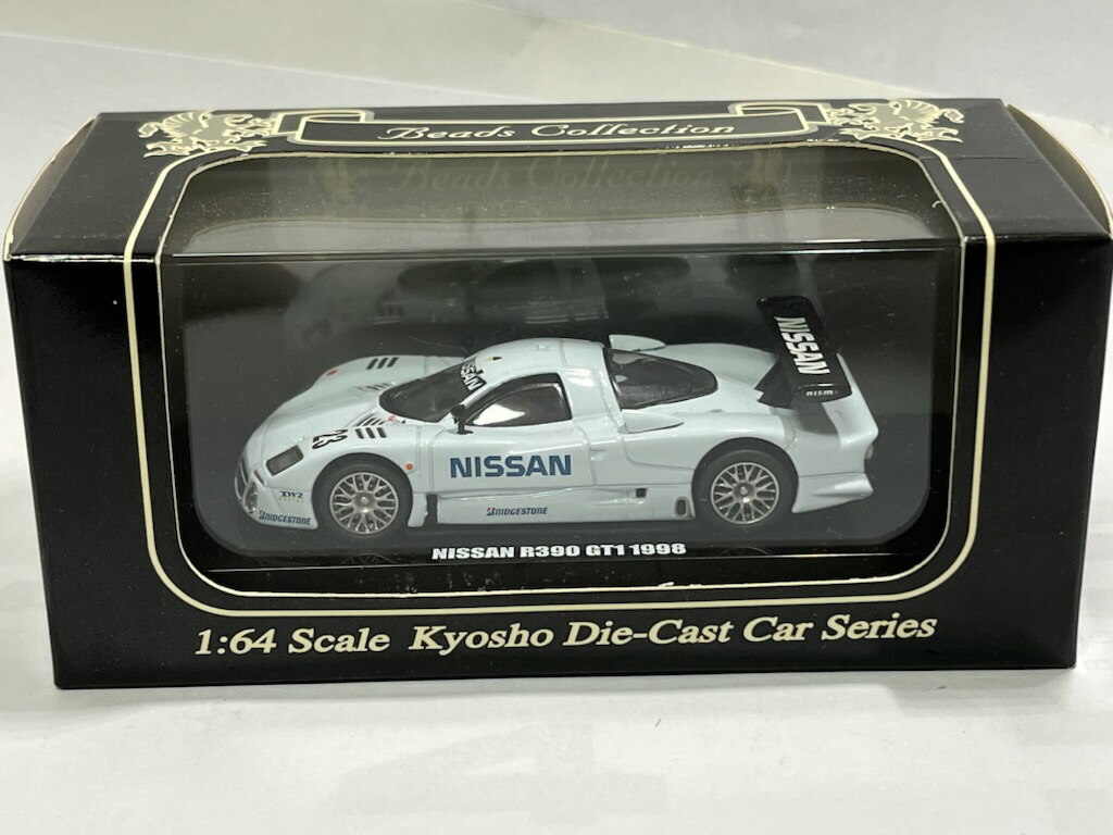 KYOSHO ニッサンレーシングカーコレクション 1/64 スケール Kyosho 1/64 Calsonic Minicar Collection Nissan R92cp #1 1992
