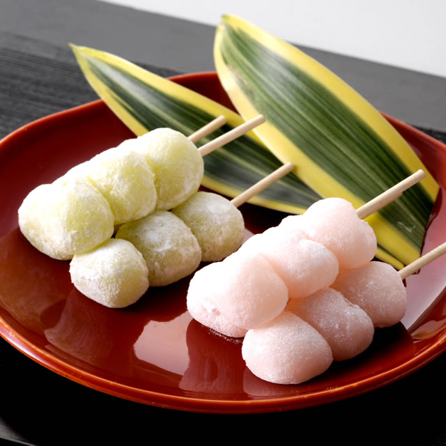 white peach flavour and muscat grape flavour japanese dango rice cakes in a skewer, one skewer has 3 pieces of rice cake balls. comes in 18 skewer set and 30 skewers set