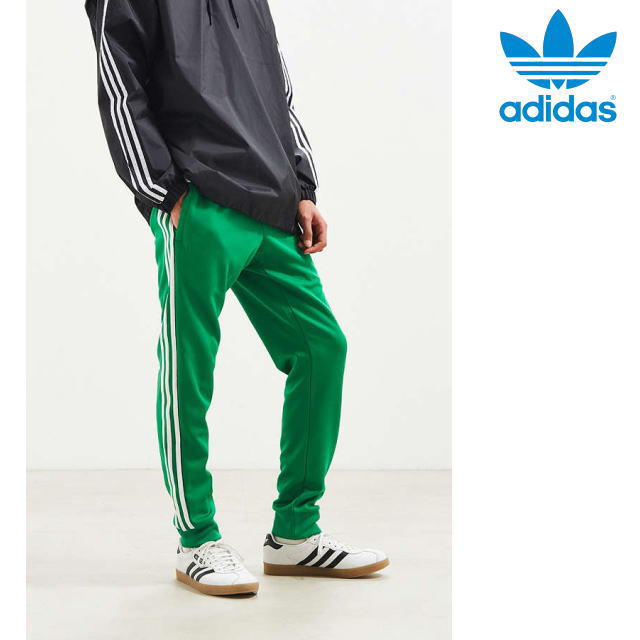 green and white adidas pants