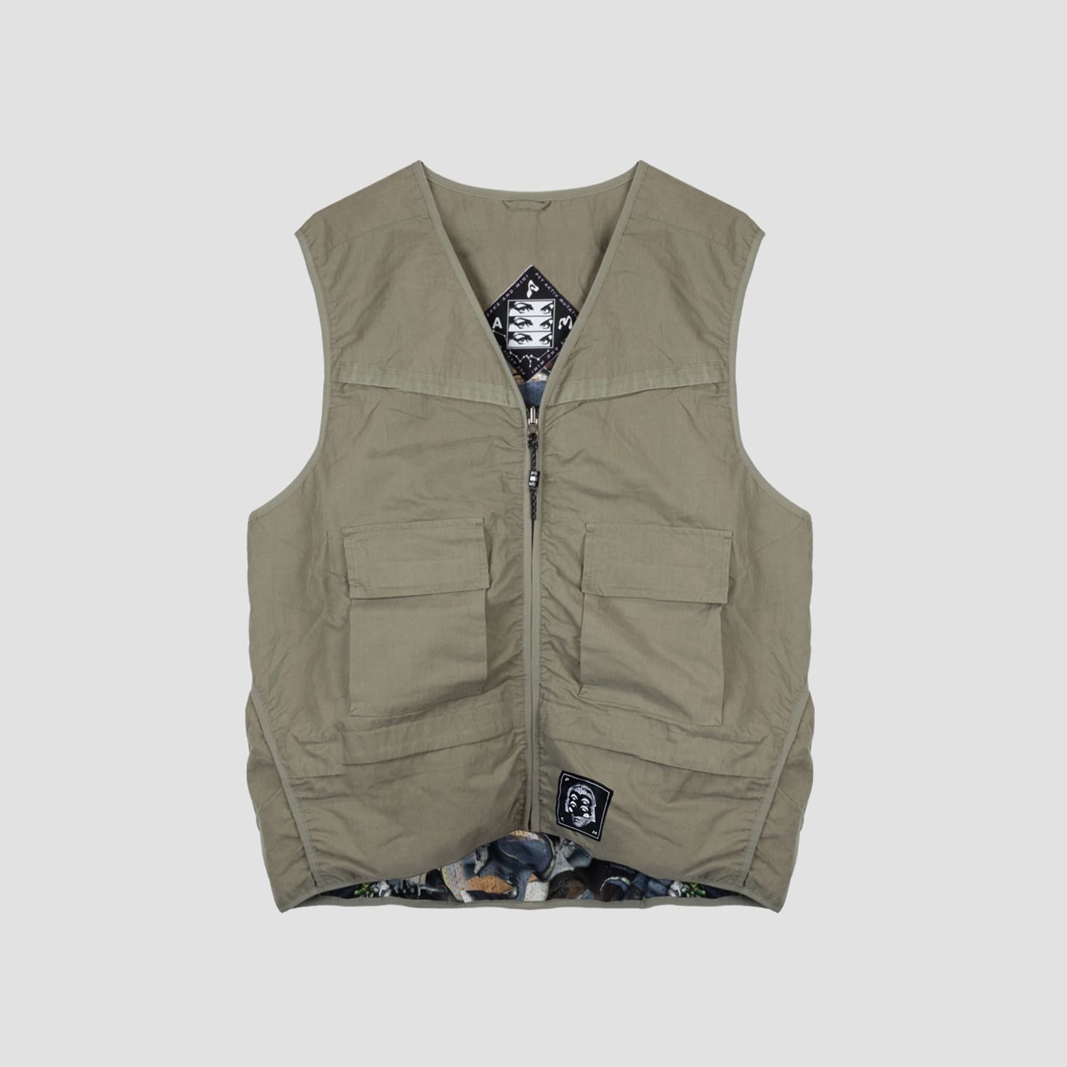 P.A.M. / PERKS AND MINI | WAXING CRESCENT VEST (KHAKI) PAM パム リバーシブルミリタリーベスト グラフィック 総柄 アウター カーキ|UNEEK BASEMNT