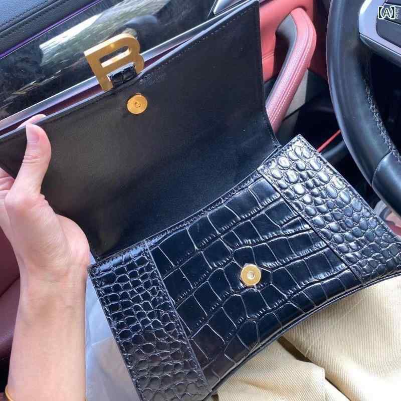 高 バージョンの本 革の 砂時計の 女性 バッグは 24 年 ワニの 紋様の 新型の 斜めな ショルダーバッグです。