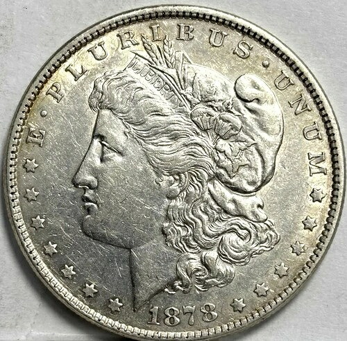 1878 年モルガン銀貨 (Rev 79)、7 TF、AU、フィラデルフィア造幣局。