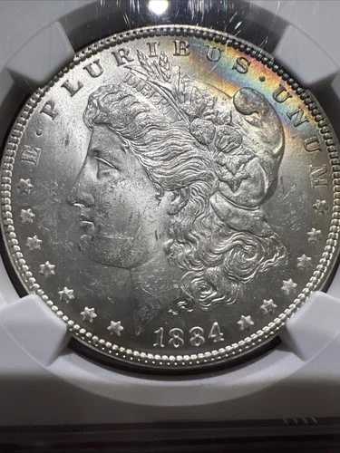1884年 NGC MS62 モルガン銀貨（レインボートーン）