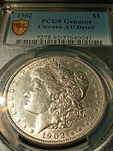 1902年製モルガン・ダラー銀貨。PCGS AU詳細。クリーニング済み。魅力的な状態。最低落札価格なし。