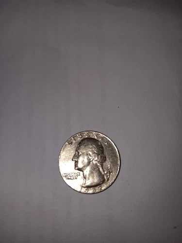 1982年クォーター硬貨。「In God We Trust」とミントマークにダブルダイス付き。