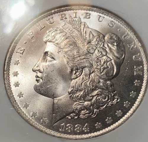 1884-O モルガン銀貨。NGC MS65。明るい白色。傷はわずか。完全に打刻済み。