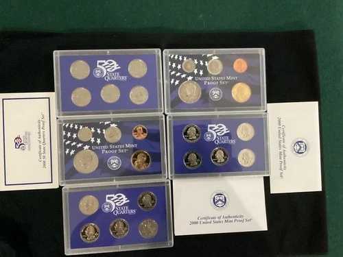 2000 年および 2006 年の米国造幣局プルーフ セットおよび州 25 セント硬貨。合計 7 箱。55 枚のコイン。