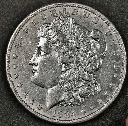 1884年頃のモルガン銀貨。胸部全面に羽根飾り。プルーフライクAU。186058
