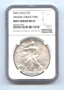 2002年 1ドル シルバーイーグル 表面ストライクスルー NGC MS67 レア ミントエラー｜WORLD RESOURCE【KING店】