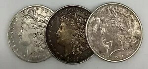 銀貨 3 枚のモーガンとピース 1900-O、1921-D、および 1925-S が流通