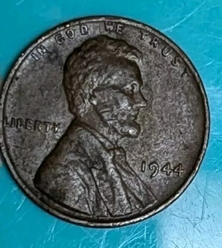 1944 年リンカーン ウィート ペニー、リムにミント マーク L なし、レター エラー、顔にストライク スルー