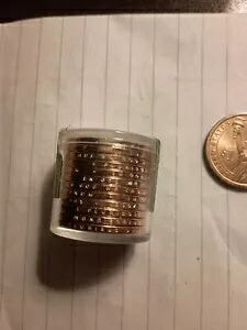 未流通のジョン・アダムス 12 枚と流通済みの 2 枚、2007 年 D ミント コイン $1